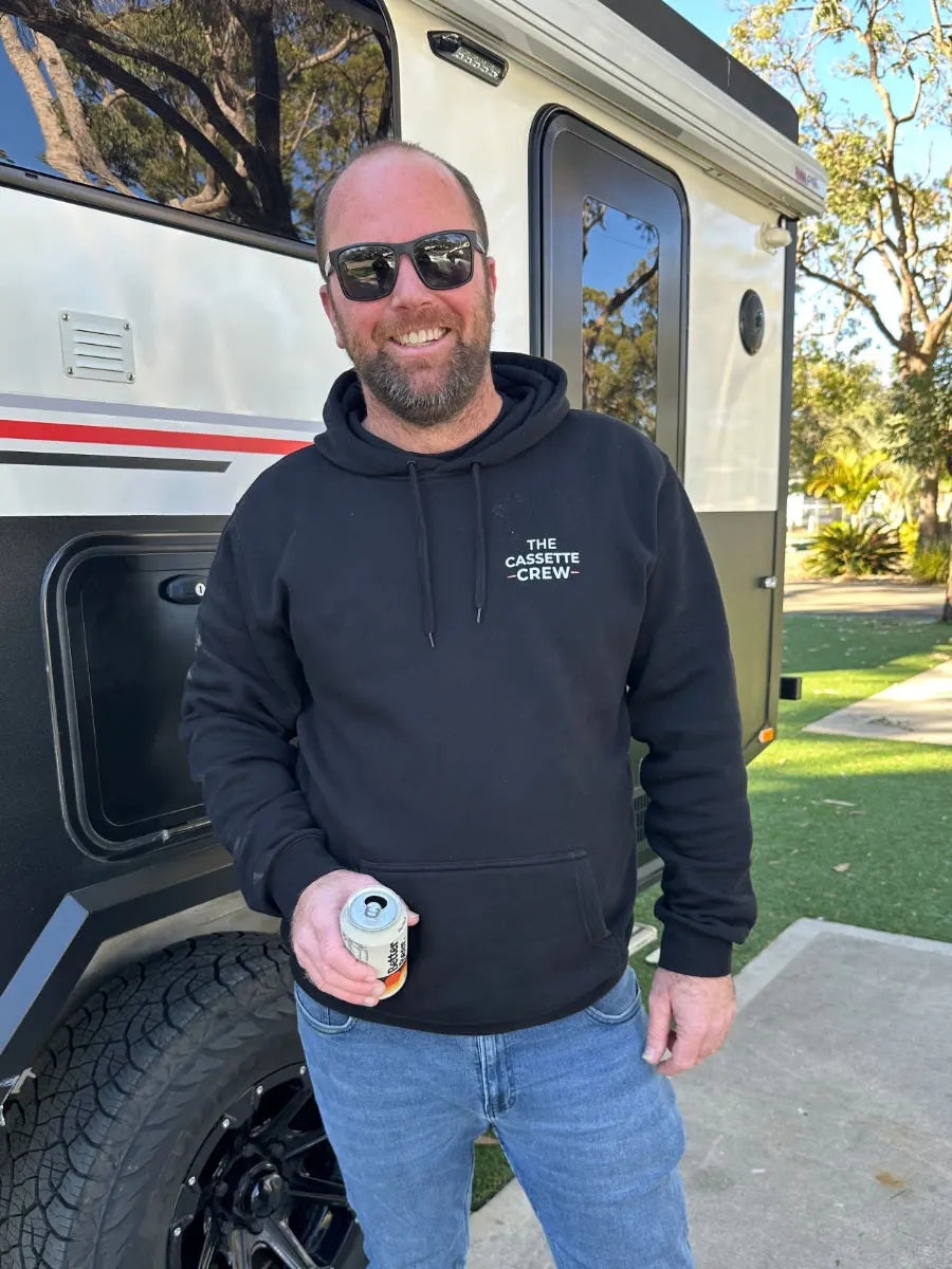 Cassette Crew founder Brennan beside a caravan